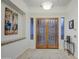 Bright and airy entryway with double doors and wood flooring at 7462 E Visao Dr, Scottsdale, AZ 85266