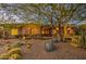 Single story home nestled in a desert landscape with mature trees at 7462 E Visao Dr, Scottsdale, AZ 85266