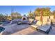 Stone fireplace with seating area and desert landscape views at 7462 E Visao Dr, Scottsdale, AZ 85266