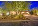 Night view of home with desert landscaping and exterior lighting at 7462 E Visao Dr, Scottsdale, AZ 85266