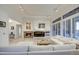 Bright and airy living room with fireplace and large windows at 7462 E Visao Dr, Scottsdale, AZ 85266