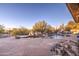 Spacious pool area with flagstone patio, fire pit and rockscaping at 7462 E Visao Dr, Scottsdale, AZ 85266