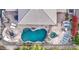 Aerial view of a freeform pool and spa with flagstone patio at 7462 E Visao Dr, Scottsdale, AZ 85266