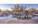 Relaxing swimming pool with waterfall feature and flagstone decking at 7462 E Visao Dr, Scottsdale, AZ 85266