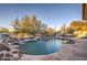 Stunning pool with waterfall, fire pit and expansive backyard at 7462 E Visao Dr, Scottsdale, AZ 85266