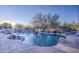 Inviting kidney-shaped pool with waterfall and flagstone patio at 7462 E Visao Dr, Scottsdale, AZ 85266