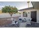 Relaxing backyard patio with seating area and mature citrus tree at 7749 E Coolidge St, Scottsdale, AZ 85251