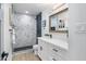 Elegant bathroom with marble tile, double vanity, and modern fixtures at 7749 E Coolidge St, Scottsdale, AZ 85251