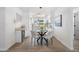 Modern dining area with glass-top table and built-in wine cooler at 7749 E Coolidge St, Scottsdale, AZ 85251