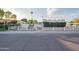 Mid-century modern home with white picket fence and landscaping at 7749 E Coolidge St, Scottsdale, AZ 85251