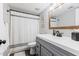 Bathroom with gray vanity, shower/tub combo, and linen closet at 7800 E Lincoln Dr # 1096, Scottsdale, AZ 85250