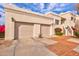 Two-car garage with tiled driveway and landscaping at 7800 E Lincoln Dr # 1096, Scottsdale, AZ 85250