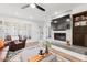 Living room features a marble fireplace, built-in shelving, and hardwood floors at 7800 E Lincoln Dr # 1096, Scottsdale, AZ 85250