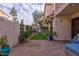 Landscaped patio with artificial turf and seating area at 7800 E Lincoln Dr # 1096, Scottsdale, AZ 85250