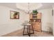 Cozy dining area with wood hutch, chandelier, and small table at 7800 E Lincoln Dr # 2092, Scottsdale, AZ 85250