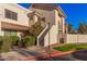 Spanish-style condo building with stairs and landscaping at 7800 E Lincoln Dr # 2092, Scottsdale, AZ 85250