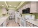 Kitchen with light wood cabinets and white appliances at 7800 E Lincoln Dr # 2092, Scottsdale, AZ 85250