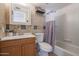 Clean bathroom featuring a shower/tub combo and wood vanity at 8225 N 34Th Dr, Phoenix, AZ 85051