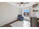 Bedroom with a ceiling fan, armchair, and wood dresser at 8225 N 34Th Dr, Phoenix, AZ 85051