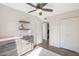 Bedroom with ceiling fan, dresser, and hardwood floors at 8225 N 34Th Dr, Phoenix, AZ 85051