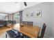 Dining area with wood table and access to the living room at 8225 N 34Th Dr, Phoenix, AZ 85051