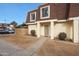 Front view of townhome with entrance, landscaping, and parking at 8225 N 34Th Dr, Phoenix, AZ 85051