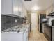 Modern kitchen with granite countertops and gray cabinets at 8225 N 34Th Dr, Phoenix, AZ 85051