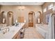 Spa-like bathroom featuring a large bathtub and double sinks at 8260 E Mohawk Ln, Scottsdale, AZ 85255