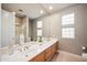 Bathroom with double sinks and a large mirror at 8260 E Mohawk Ln, Scottsdale, AZ 85255