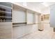 Large walk-in closet with ample shelving and drawers at 8260 E Mohawk Ln, Scottsdale, AZ 85255