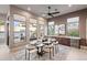 Casual dining area with a wooden table and backyard views at 8260 E Mohawk Ln, Scottsdale, AZ 85255