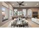 Bright dining room features a dark wood table with seating for four and large windows at 8260 E Mohawk Ln, Scottsdale, AZ 85255