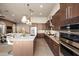 Open concept kitchen with stainless steel appliances and ample counter space at 8260 E Mohawk Ln, Scottsdale, AZ 85255