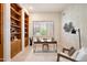 Home office with built-in shelving and window at 8260 E Mohawk Ln, Scottsdale, AZ 85255