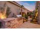 Backyard with built-in grill and stonework at 8260 E Mohawk Ln, Scottsdale, AZ 85255