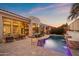 Relaxing pool area with patio furniture and a water feature at 8260 E Mohawk Ln, Scottsdale, AZ 85255