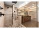 Modern bathroom with walk-in shower and tiled walls at 8438 N 84Th Pl, Scottsdale, AZ 85258