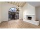 Bright dining room features a fireplace and large arched window at 8438 N 84Th Pl, Scottsdale, AZ 85258