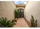 Inviting entryway with decorative iron doors at 8438 N 84Th Pl, Scottsdale, AZ 85258