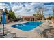 Inviting community pool with lounge chairs and umbrellas at 8438 N 84Th Pl, Scottsdale, AZ 85258