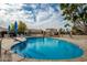 Relaxing community pool with surrounding landscaping at 8438 N 84Th Pl, Scottsdale, AZ 85258