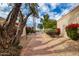 Brick walkway leading to serene waterfront views at 8438 N 84Th Pl, Scottsdale, AZ 85258