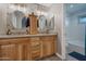 Double vanity bathroom with granite countertops and updated fixtures at 859 N 54Th Cir, Mesa, AZ 85205