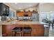 Well-equipped kitchen with granite countertops and a breakfast bar at 859 N 54Th Cir, Mesa, AZ 85205