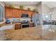 Spacious kitchen boasts granite countertops, stainless steel appliances, and breakfast bar at 859 N 54Th Cir, Mesa, AZ 85205