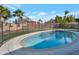 Inviting kidney-shaped pool with safety fence at 859 N 54Th Cir, Mesa, AZ 85205