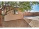 Tan storage shed with window and brick pathway at 859 N 54Th Cir, Mesa, AZ 85205