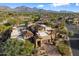 Aerial view of home showcasing its architecture and mountain views at 9270 E Thompson Peak Pkwy # 335, Scottsdale, AZ 85255