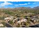 Aerial view of community with golf course and mountain backdrop at 9270 E Thompson Peak Pkwy # 335, Scottsdale, AZ 85255