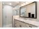 Modern bathroom with a walk-in shower and granite countertop at 9270 E Thompson Peak Pkwy # 335, Scottsdale, AZ 85255